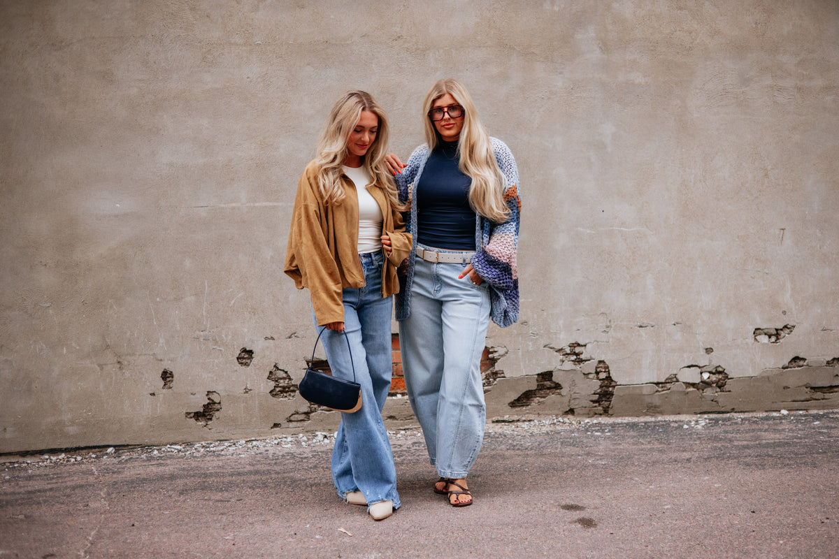 Two Wild Oak Boutique creators wearing neutral dresses